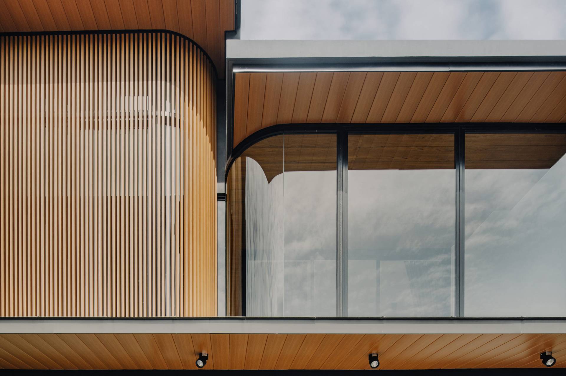 hardis-curve-wood-house a photo of modern house